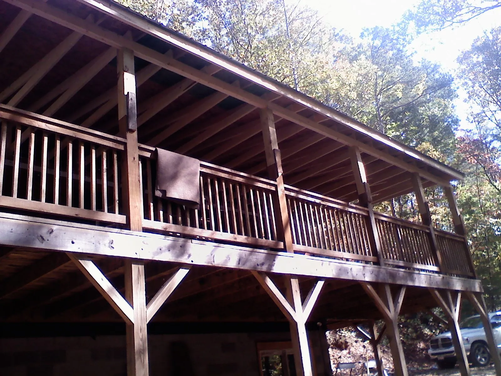 Timber framing under a new elevated porch and deck — Roof Leak Repair in Elko New Market by Roofing Brothers